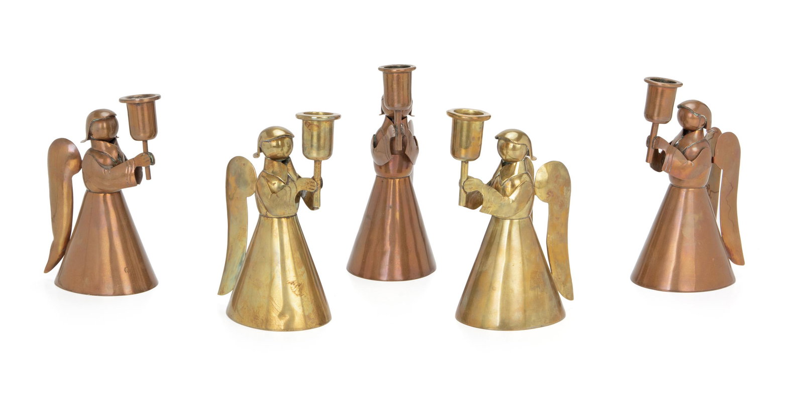 Five Los Castillo brass and copper angel candlesticks: Third quarter 20th century All but one stamped: Los Castillo / Hecho en Mexico / Handwrought Comprising two brass and three copper candlesticks, 5 pieces Each approximately: 7.5" H x 5.625" W x 3.325"