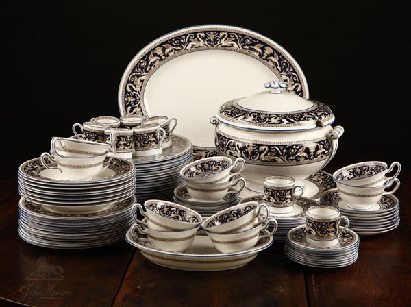 A Wedgwood 'Florentine' pattern dinner service: 20th century, marked ''Wedgwood / Bone China / Made in England / Florentine / W1956, comprising: 18 dinner plates (10.5''), 12 dessert / salad plates (8''), 11 bread plates (6''), 8 soup bowls (8''), 