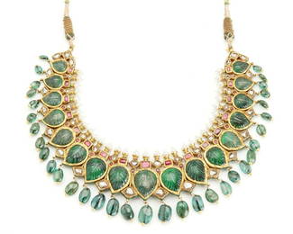 An Indian carved emerald and diamond necklace