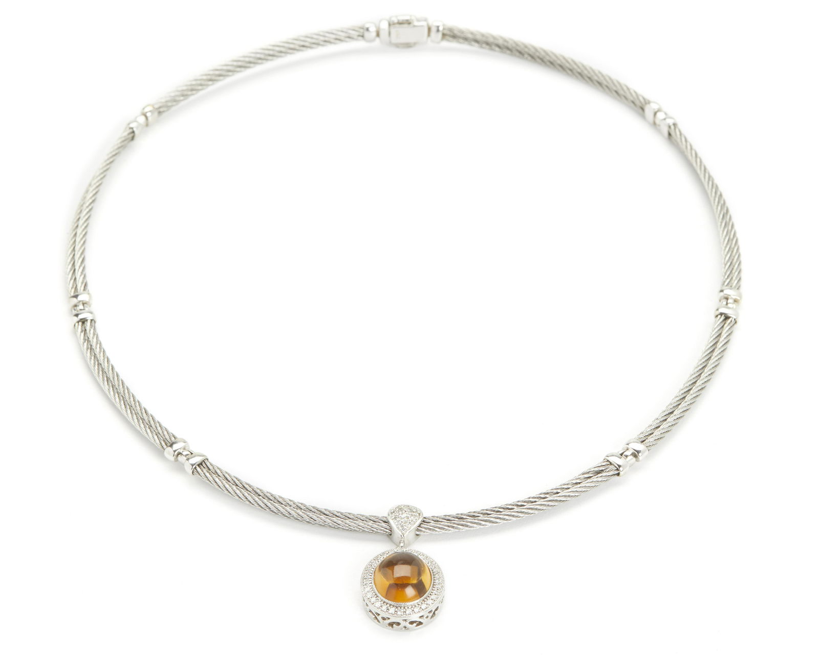 A Charriol amber and diamond necklace: 18k white gold, stamped for Charriol The rigid roped collar suspending a pendant centering an amber cabochon with diamond frame, with original box 15" L x 1" H x .625" W 21.5 grams