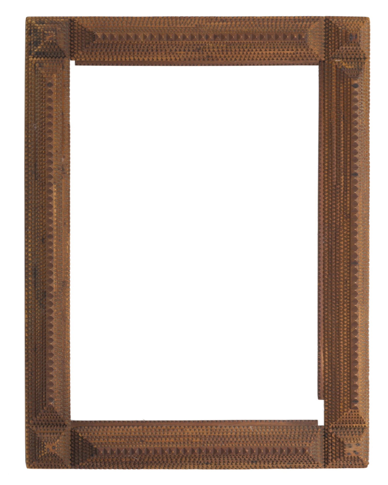 A chip-carved tramp art picture frame: First-quarter 20th Century The carved frame with stepped pyramid designs 30.25" H x 22.75" W x 2.5" D Provenance: The Collection of Cindy Tietze-Hodosh and Stuart Hodosh