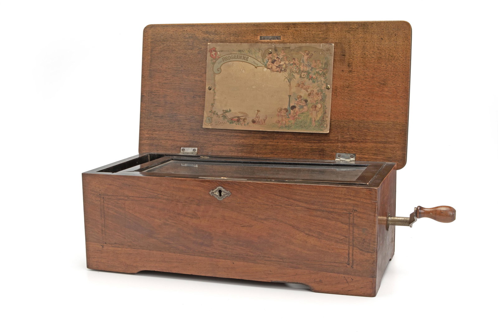 A small table top Swiss music box: Circa 1888 Labeled: M/F with maker's mark With one aire 6.5" H x 17.25" W x 9" D