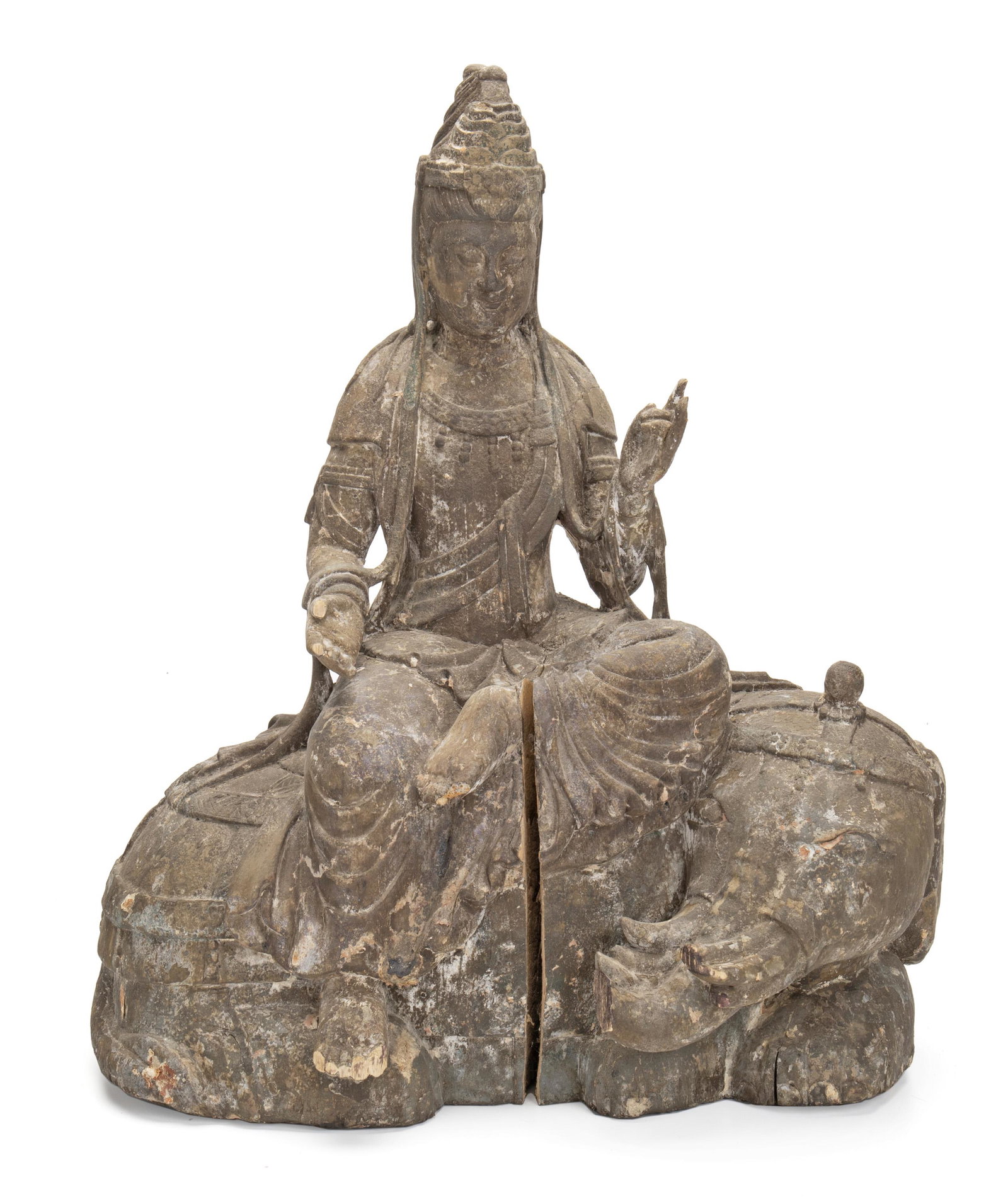A Chinese carved wood Guan Yin figure: 19th Century or earlier Depicting the Goddess of Mercy with downcast eyes in meditation performing the Karana Mudra seated atop an elephant 18" H x 15.25" W x 10" D