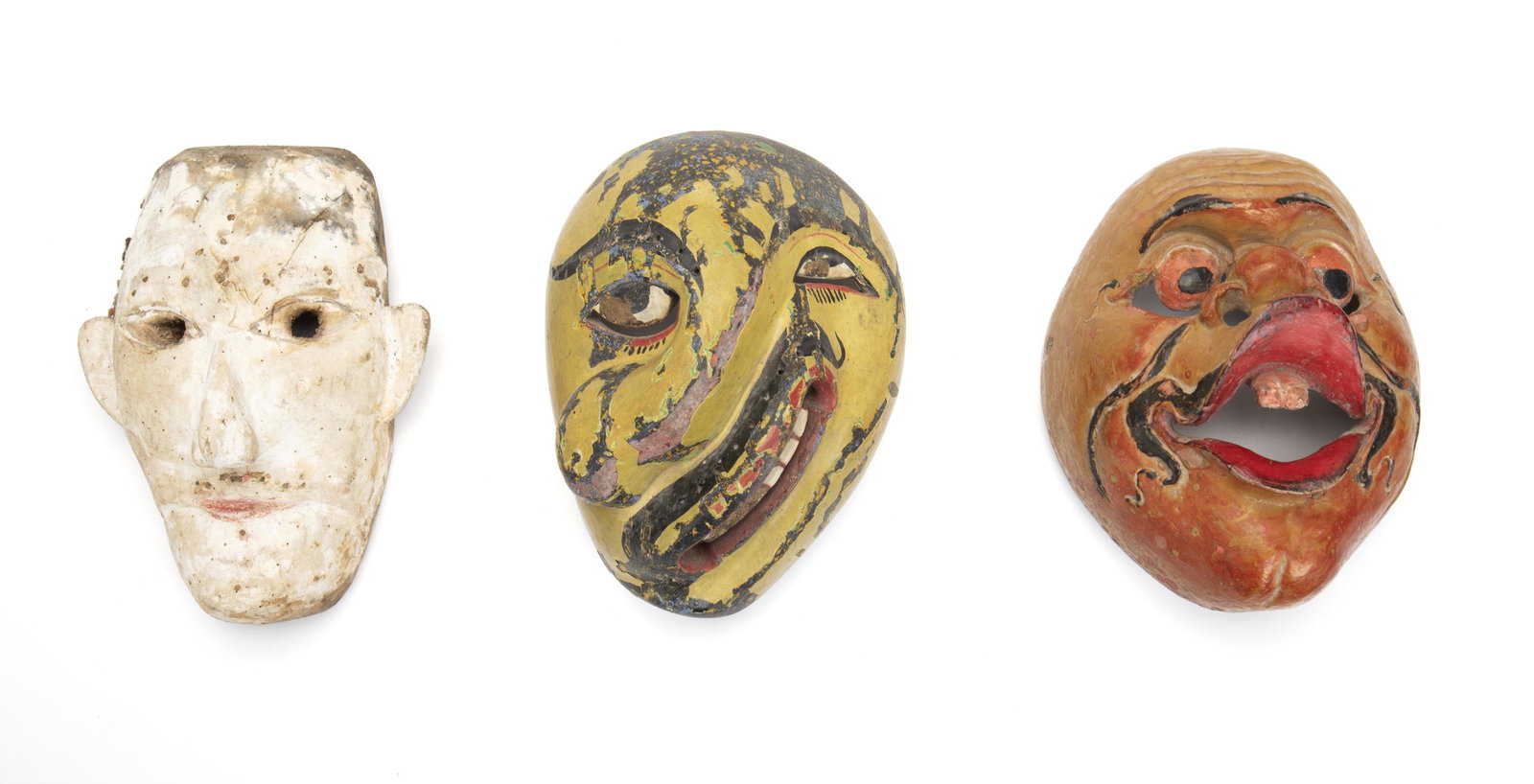 A group of Indonesian and Sri Lankan masks: 20th Century; Java and Sri Lanka Comprising three polychromed carved wood figural masks, 3 pieces Largest: 8" H x 5.875" W x 4" D Provenance: Sickness mask, Sri Lanka, James Willis Gallery, San Franci