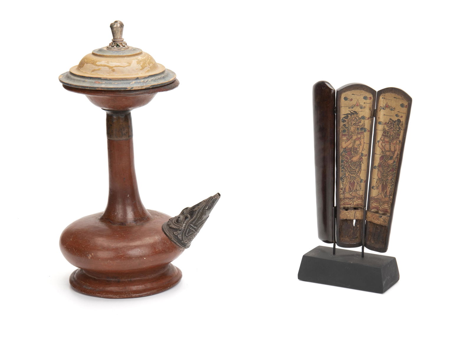 Balinese "Kendi" holy water bottle and "Kotak Taji": 20th Century; Bali, Indonesia Comprising a ceramic holy water bottle with footed base, elongated neck, ornamented metal spout, and polychromed wood lid with a gemstone-set finial and a tri-folding co