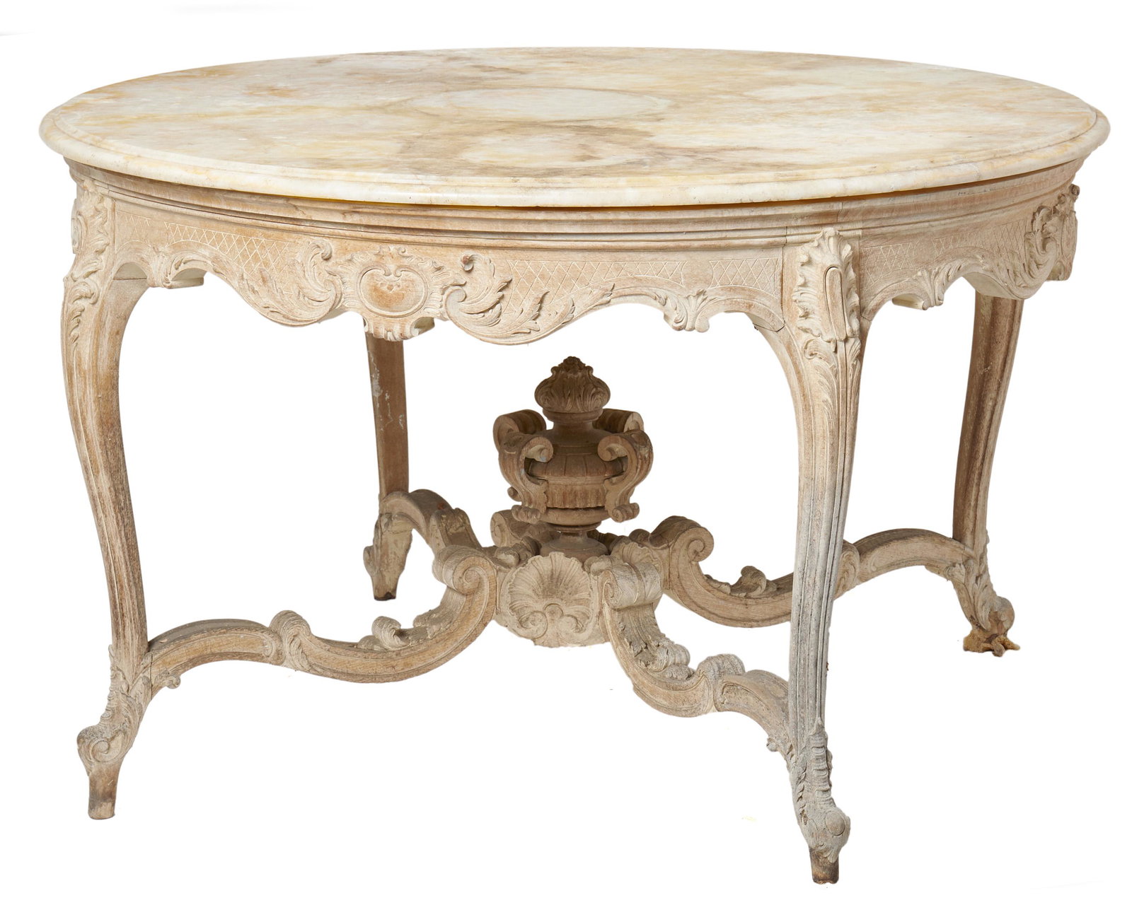 A Louis XV-style round library table: Late 19th/early 20th Century The beech wood table with marble top above a carved apron raised on cabriole legs with ornamented ogee stretcher 30" H x 46.5" Dia.