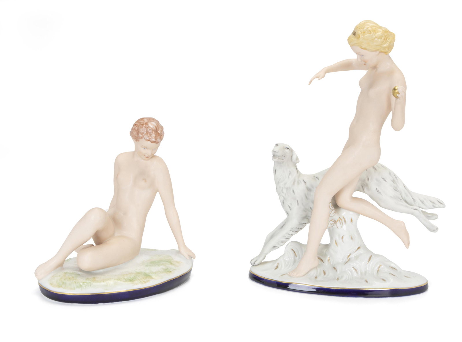 Two Royal Dux female nude figures: Second-half 20th Century Each stamped for Royal Dux Comprising a blond with borzoi and a reclining seated nude, 2 pieces Taller: 14.125" H x 10.125" W x 3.25" D
