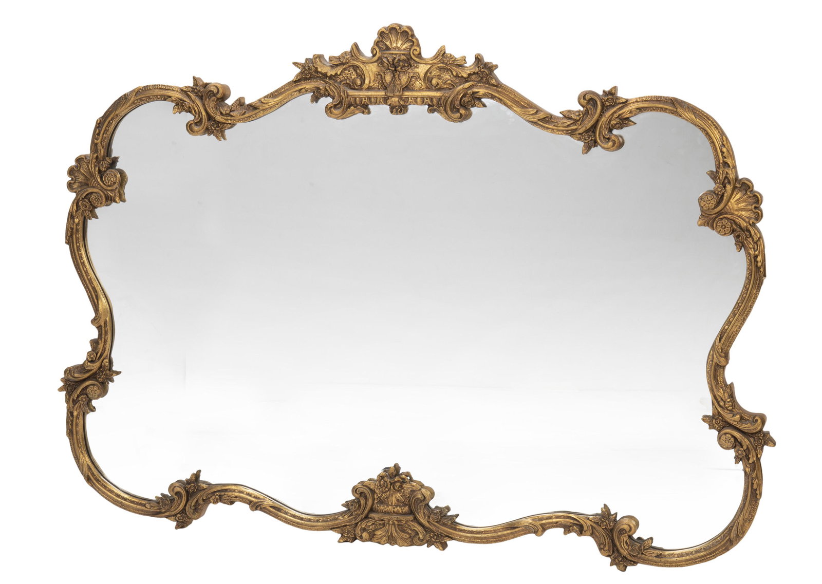A carved giltwood wall mirror: First-half 20th Century The carved cornice with floral motifs atop a carved ogee frame adorned with scrolling foliage and floral motifs enclosing an ogee glass mirror 47" H x 70" W x 2" D