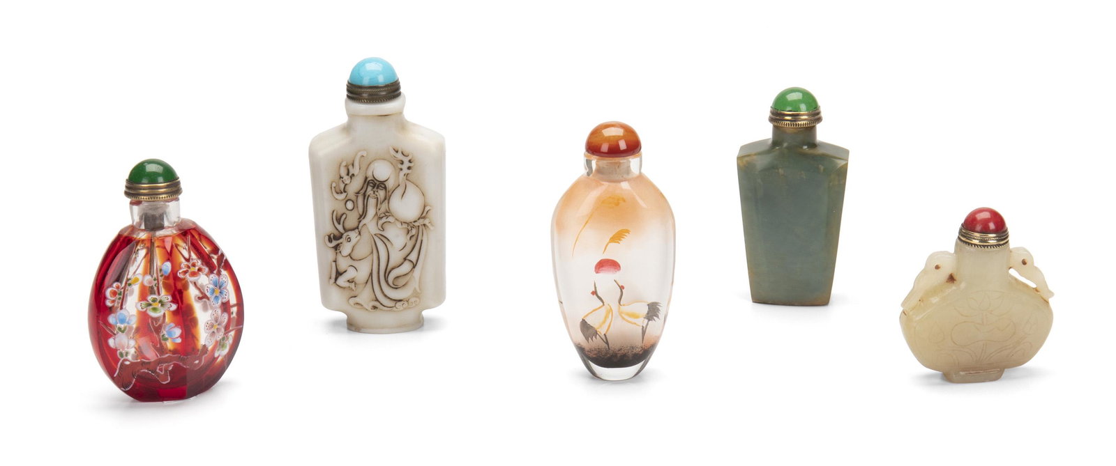 A group of Chinese snuff bottles: 20th Century Comprising a carved white stone bottle with figural motifs and Chinese characters, a carved Hetian nephrite jade bottle with floral motifs and open-work details, a tapered jade bottle, a 
