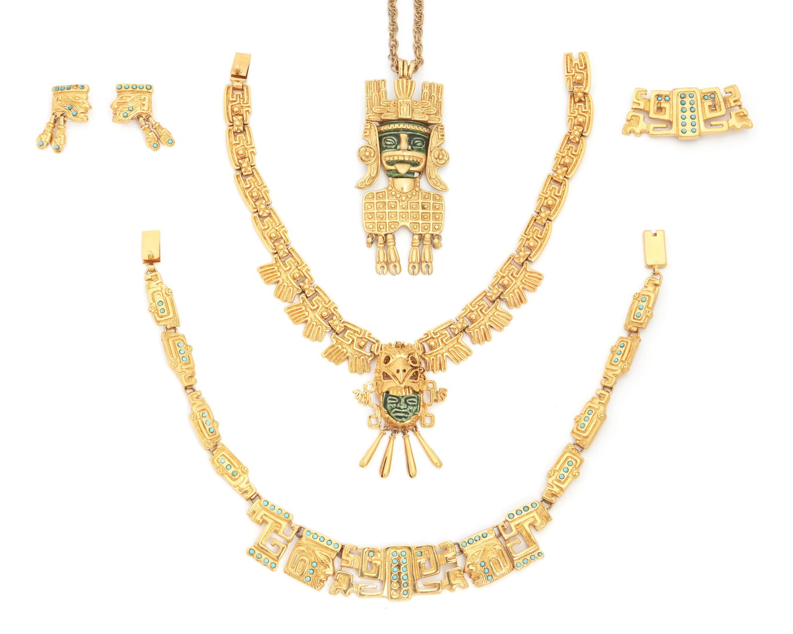 A group of Marbel for Salvador Teran Aztec-motif: 1950-1960; Taxco, Mexico Cast mark: Marbel S. A. Salvador Mexico Each 22K gold plated base metal, comprising a pendant with green ceramic face (25" L x 4" H x 2" W), a ceramic head and bird-motif broo