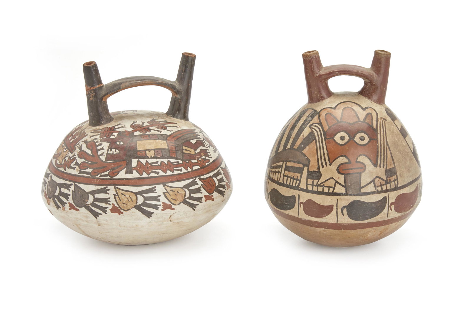 Two Pre-Columbian Nazca jars: Circa 400 BCE-600 CE Each double spout and stirrup handled vessel polychromed earthenware, comprising one depicting flying deities surmounting a band of trophy heads and one depicting feline figures s