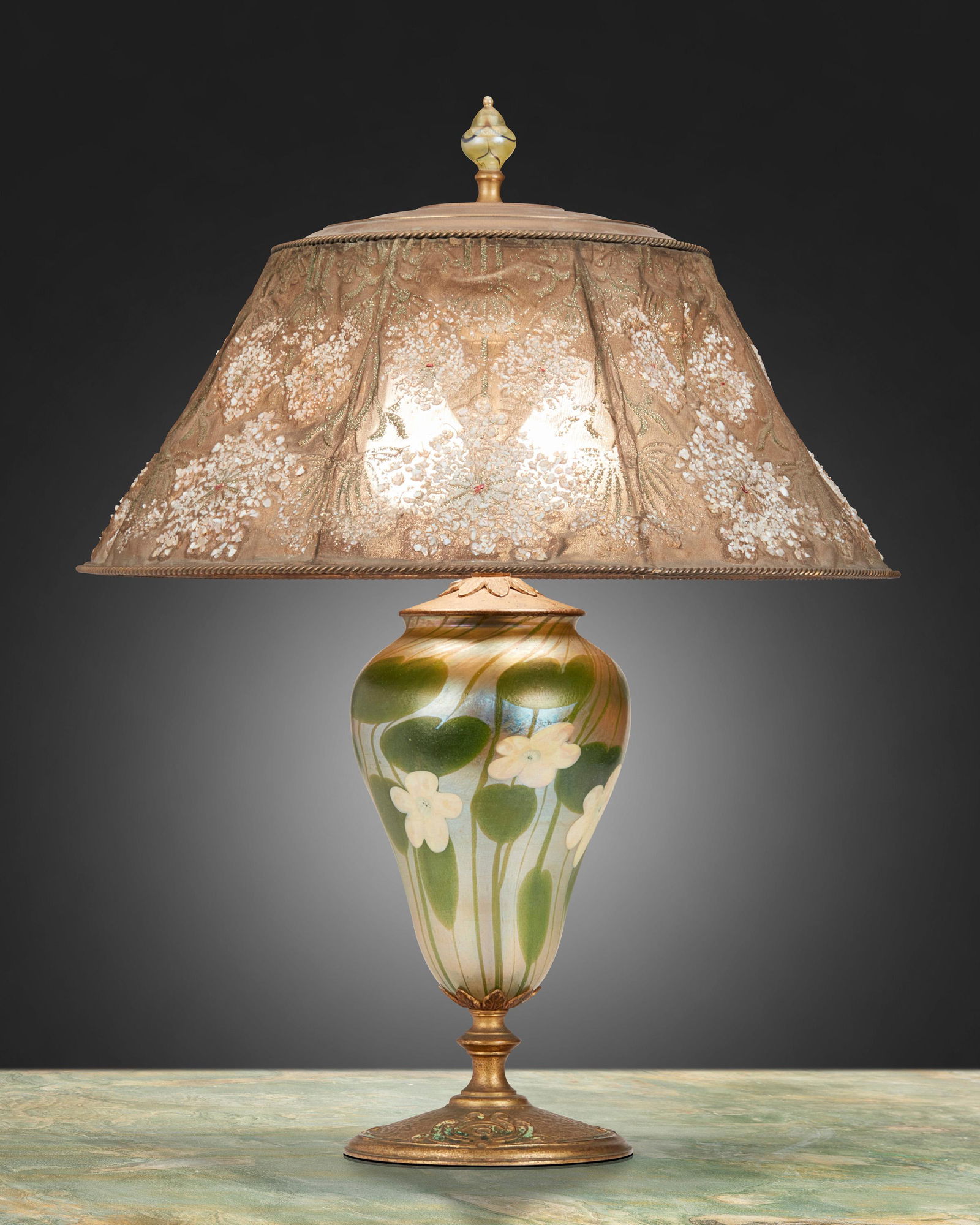 A Tiffany Studios Favrile glass table lamp: Circa 1919-1928; New York, NY Shade signed: Louis C. Tiffany Furnaces, Inc. / [L.C.T. monogram] / Favrile / 903 / Pat. Appd. For; Base signed: Louis C. Tiffany Furnaces, Inc. / [L.C.T. monogram] Favr