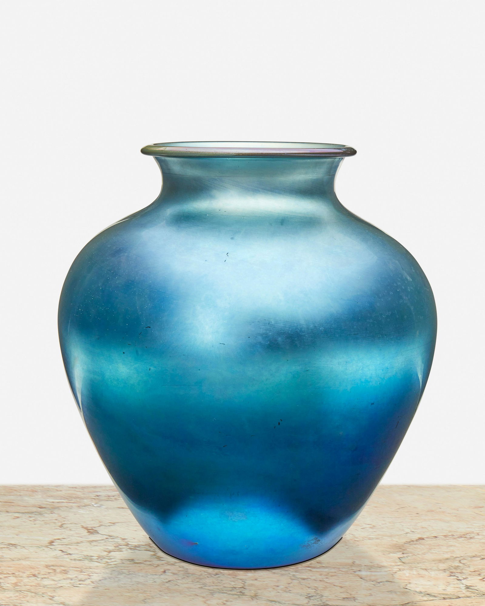 A blue Steuben Aurene glass vase: Circa 1905-1933; Corning, New York Signed: Steuben / Aurene / 2683 The blue Aurene glass vase, model no. 2683, with wide-shouldered body and flared neck 10.75" H x 10" Dia. Provenance: The Alan S