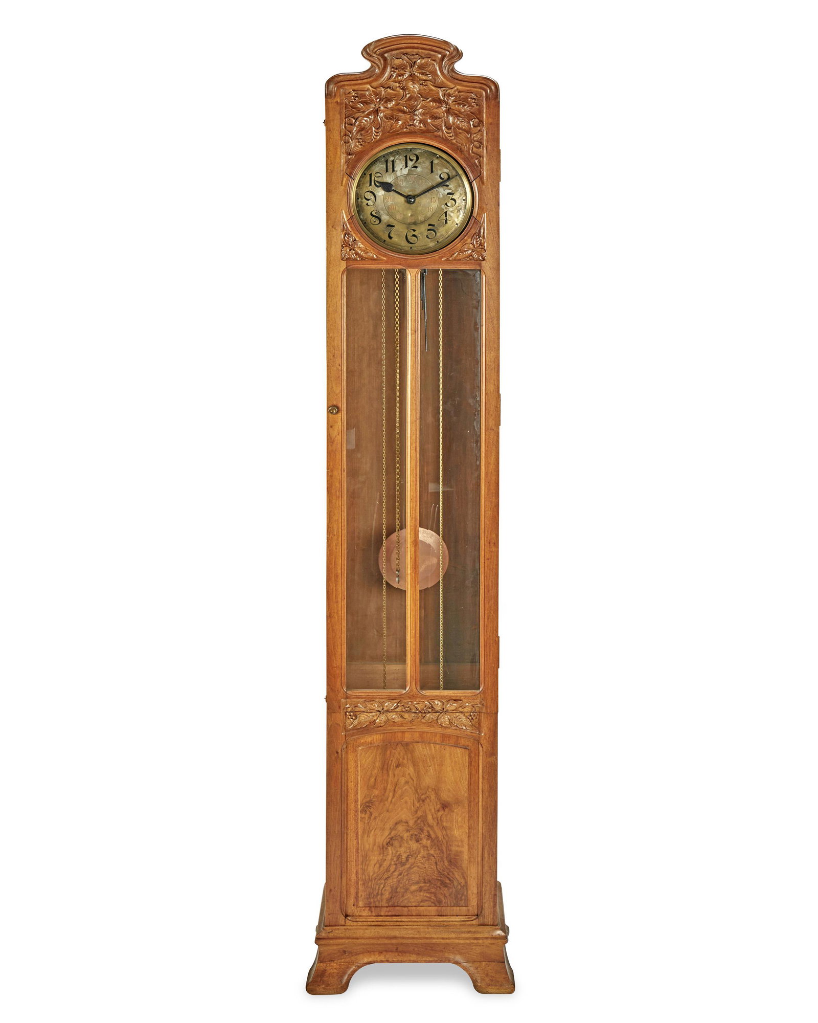 A Jugendstil walnut longcase clock: Late 19th/early 20th Century; Germany Movement signed: Mullko 21 / Harmonie Vollgong / P 100 1955331 With a silvered dial with black Arabic numerals through twelve, red Arabic numerals through twenty-