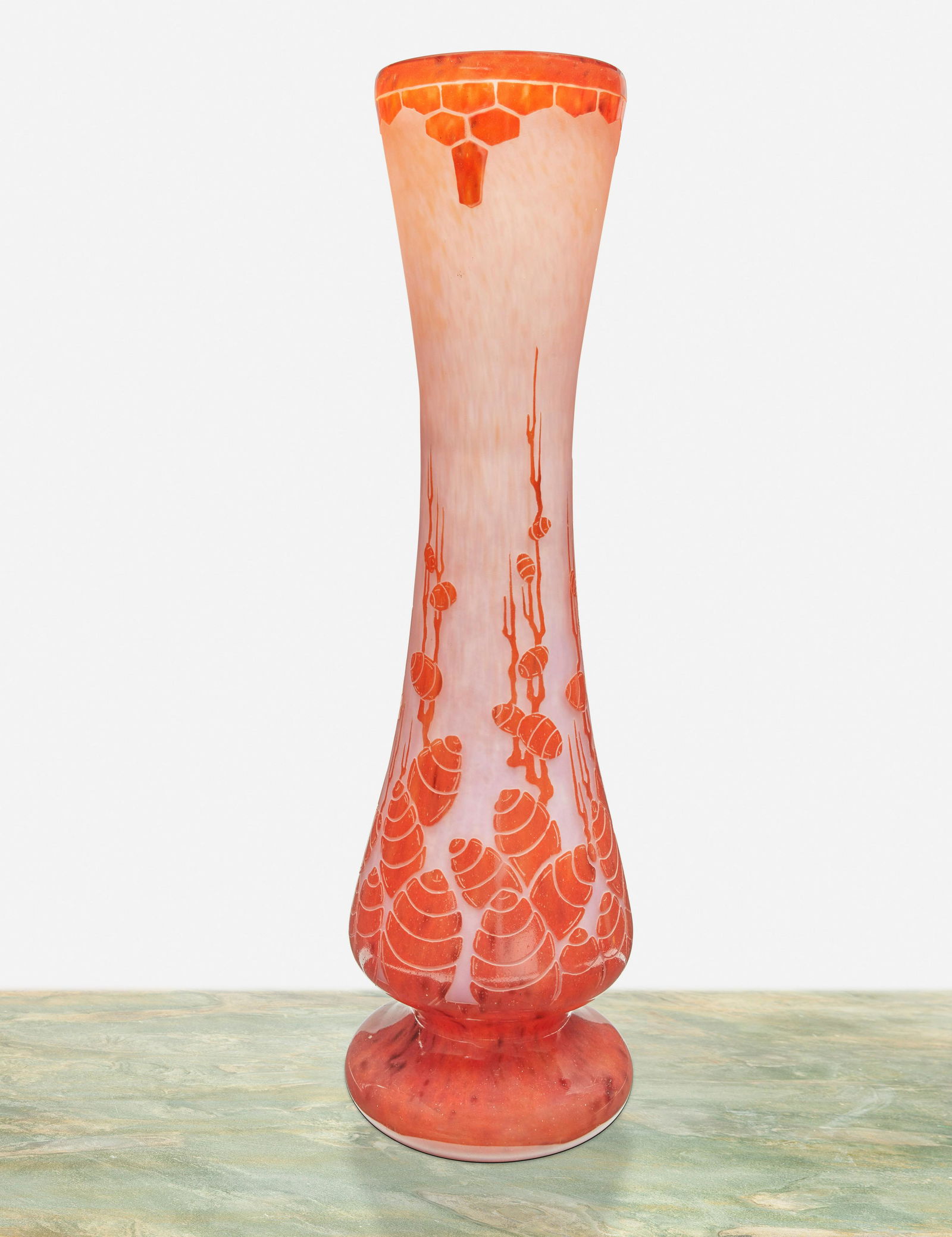 A Charles Schneider Le Verre Francais glass vase: Circa 1918-1932; Paris, France Signed: Charder / Le Verre Francais The acid-etched cameo glass vase with flared body and footed base cut from mottled orange to pink frost with cedar buds motif and g