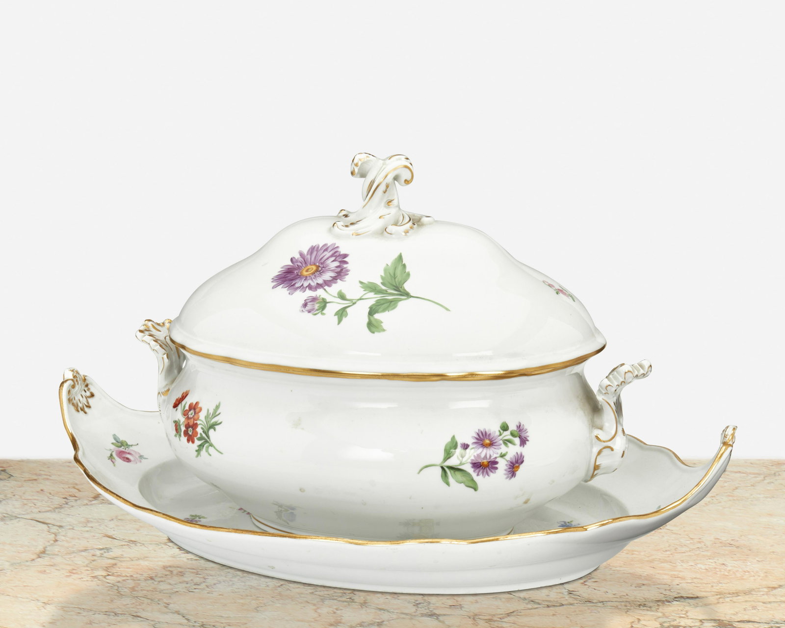 A Meissen lidded tureen and underplate: Late 19th/early 20th Century; Germany Each marked for Meissen [Blue Crossed Swords underglaze]; Further marked: 671 1 / 16 Each white porcelain with polychrome floral sprays and gilt highlights, compr