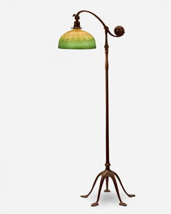 A Tiffany Studios counter-balance floor lamp: Circa 1902-1919; New York, NY Shade signed: L.C. Tiffany / Favrile; Base singed: Tiffany Studios / New York / 468 The green and gold iridescent damascene Favrile glass shade on a single-light