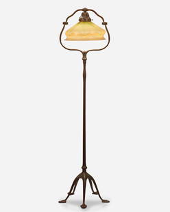 A Tiffany Studios harp floor lamp: Circa 1902-1919; New York, NY Shade signed: L.C.T.; Base signed: Tiffany Studios / New York / 423 H The green and cream iridescent Favrile glass shade with pulled feather motif on a