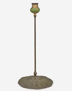 A Tiffany Studios "Wild Carrot" bronze and Favrile: Circa 1900-1902; New York, NY Signed: Tiffany Studios / New York / [T.G.D.Co. monogram] / D 555 The green blown Favrile glass capital and removable bobeche raised on a patinated bronze "Wild