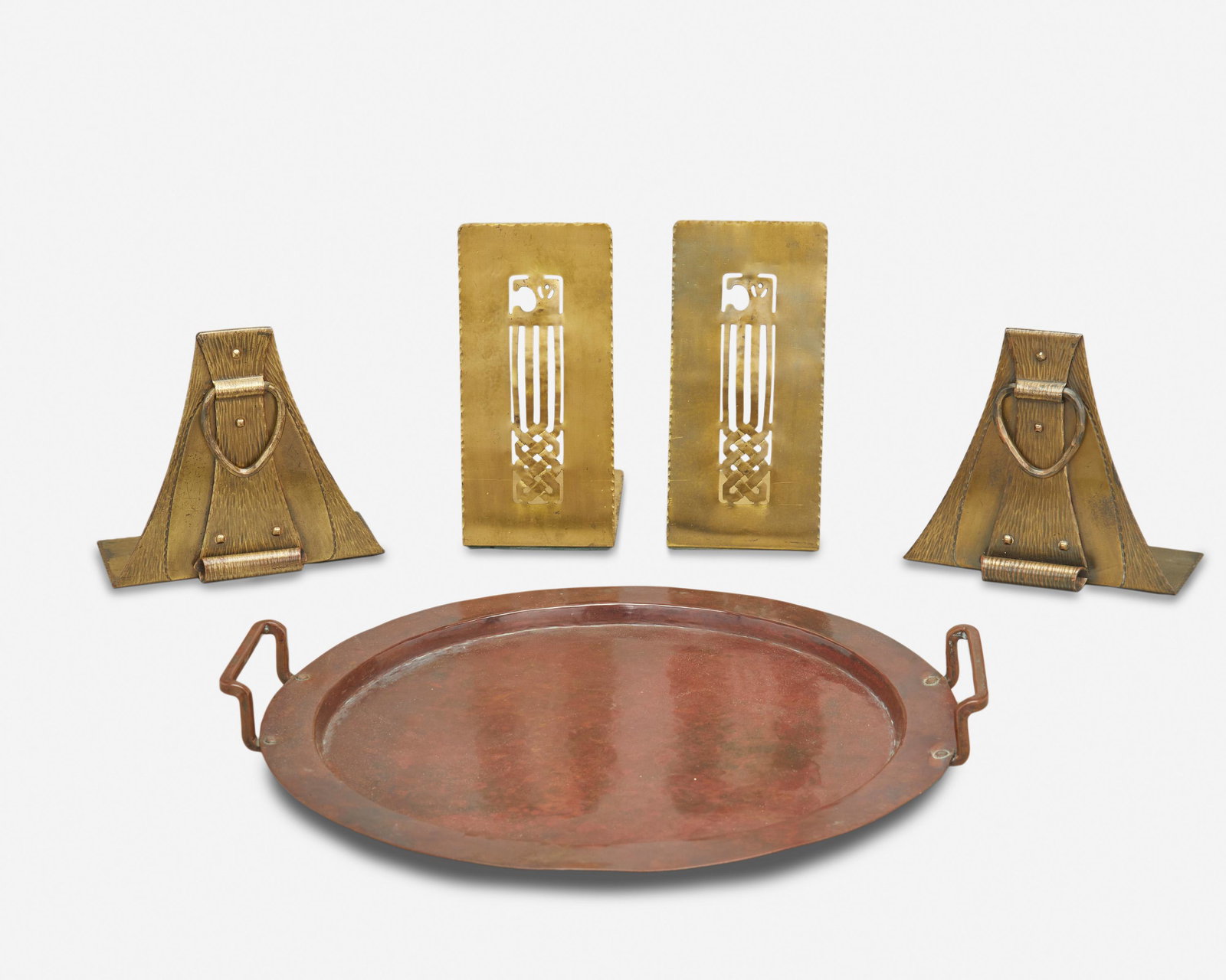 A group of American Arts and Crafts metal accessories: First-quarter 20th Century First marked: Handwrought by F. Novick / Chicago; Second marked: Forest Craft Guild; Third marked: [Roycroft orb and cross middle mark] Comprising a Falick Novick hand-wroug