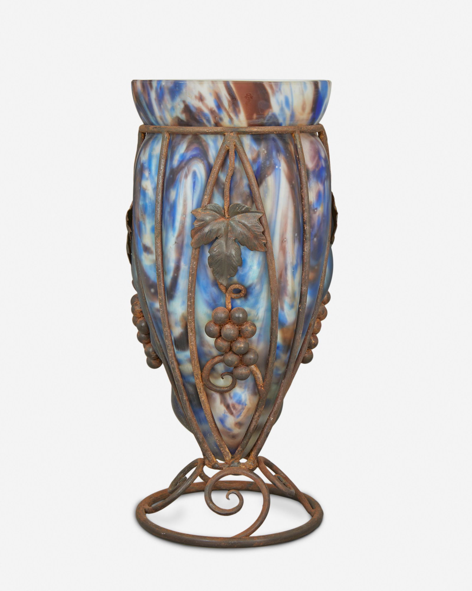 A Charles Schneider Le Verre Francais wrought iron and: Circa 1918-1932; Epinay-sur-Seine, France Signed: Le Verre Francais [Croix de Lorraine] The Art Deco tapered vase with mottled blue and purple cased glass blown in a wrought iron cage with grapevine