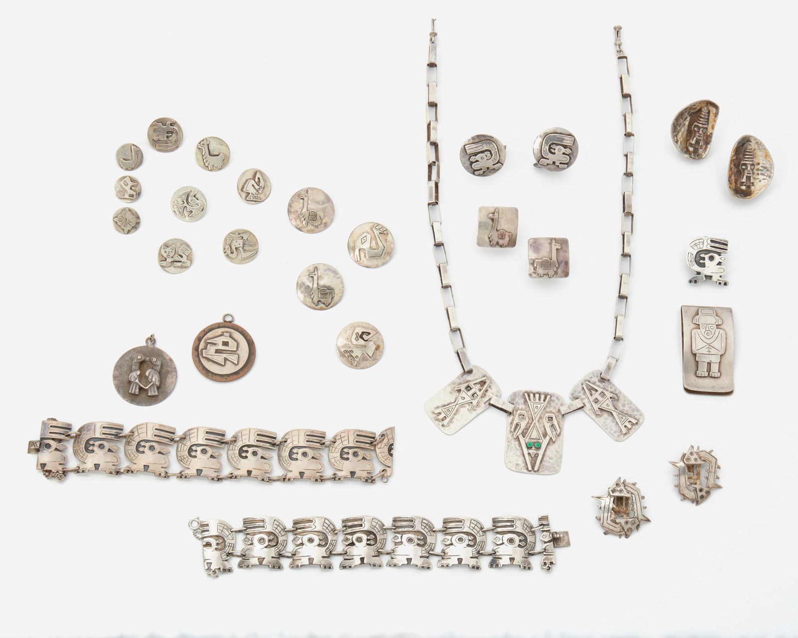 A group of Graziella Laffi Peru silver jewelry: Third-quarter 20th Century; Peru Each stamped: Peru / Laffi / 925 Each designed with stylized animals, comprising a three panel necklace, a pair of link bracelets, matching brooch, and a pair of mat