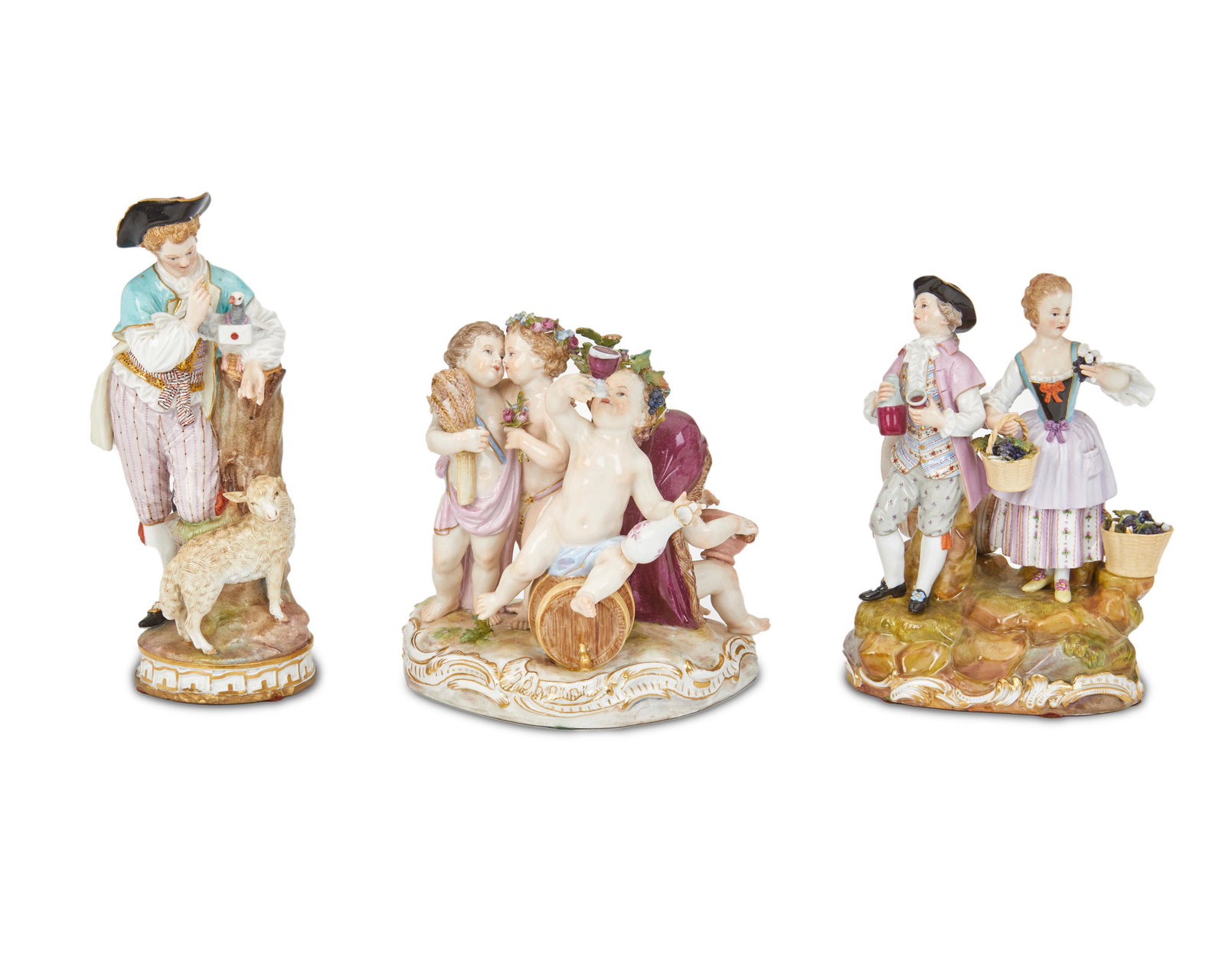 Three Meissen figural groups: Mid-19th Century Each marked for Meissen [blue underglaze crossed swords]; Further numbered: F 73 127 / 162 / 1068 42 Comprising a young man with messenger pigeon and lamb, vintners, and frolicking pu