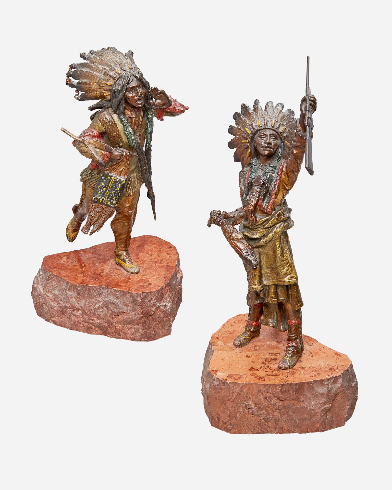 After Carl Kauba (1865-1922, Austrian): Two works A Native American figure with a rifle and full feathered headdress Cold painted and patinated bronze on red marble base Stamped and numbered: GESCHUTZT/ 6254 / Kauba 12" H x 4.5" W x 4" D A