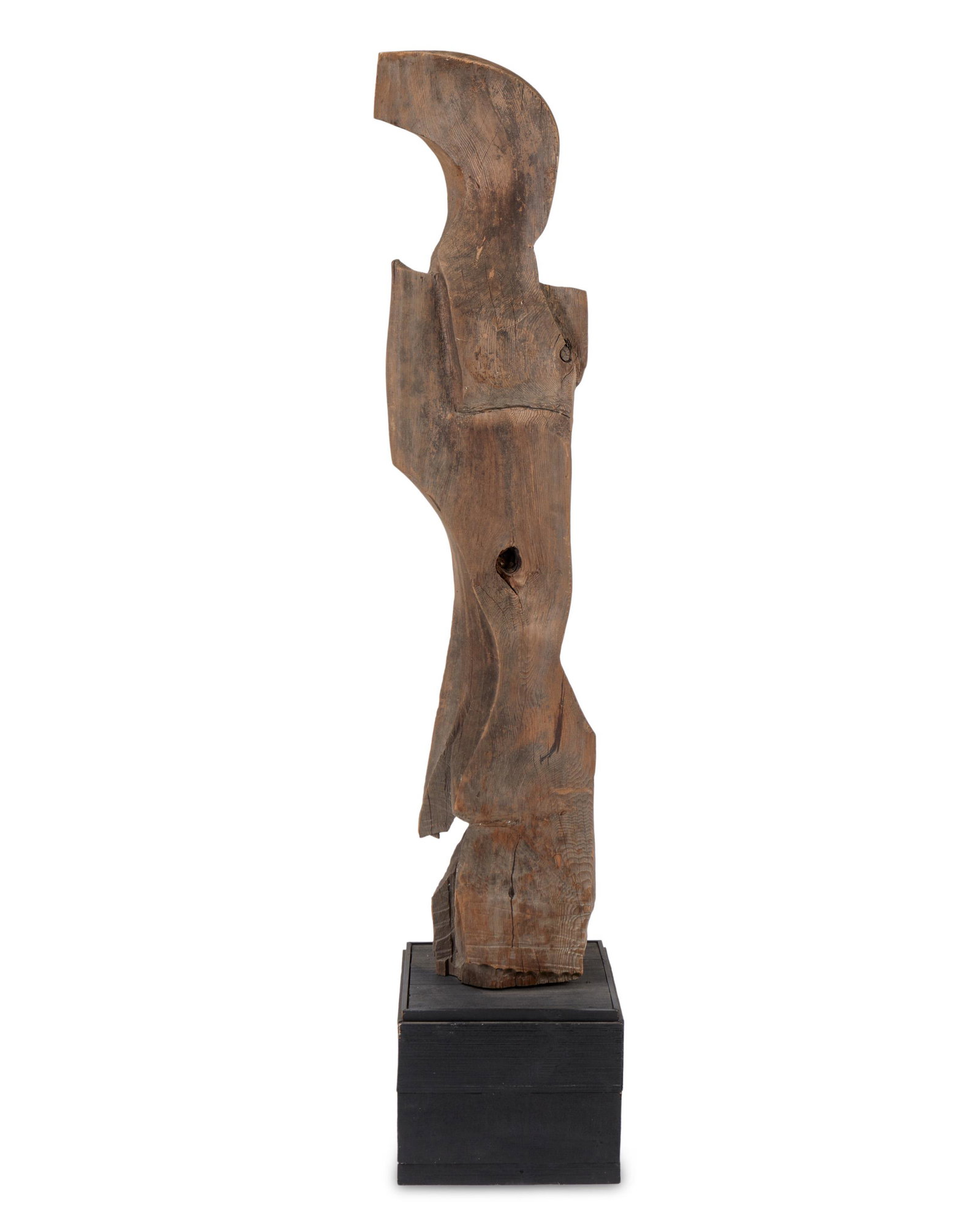 A free-form carved wood sculpture: Second-half 20th Century Unsigned On wood base 59.5" H x 14" W x 6" D Provenance: From the Collection of the Dharam Damama's