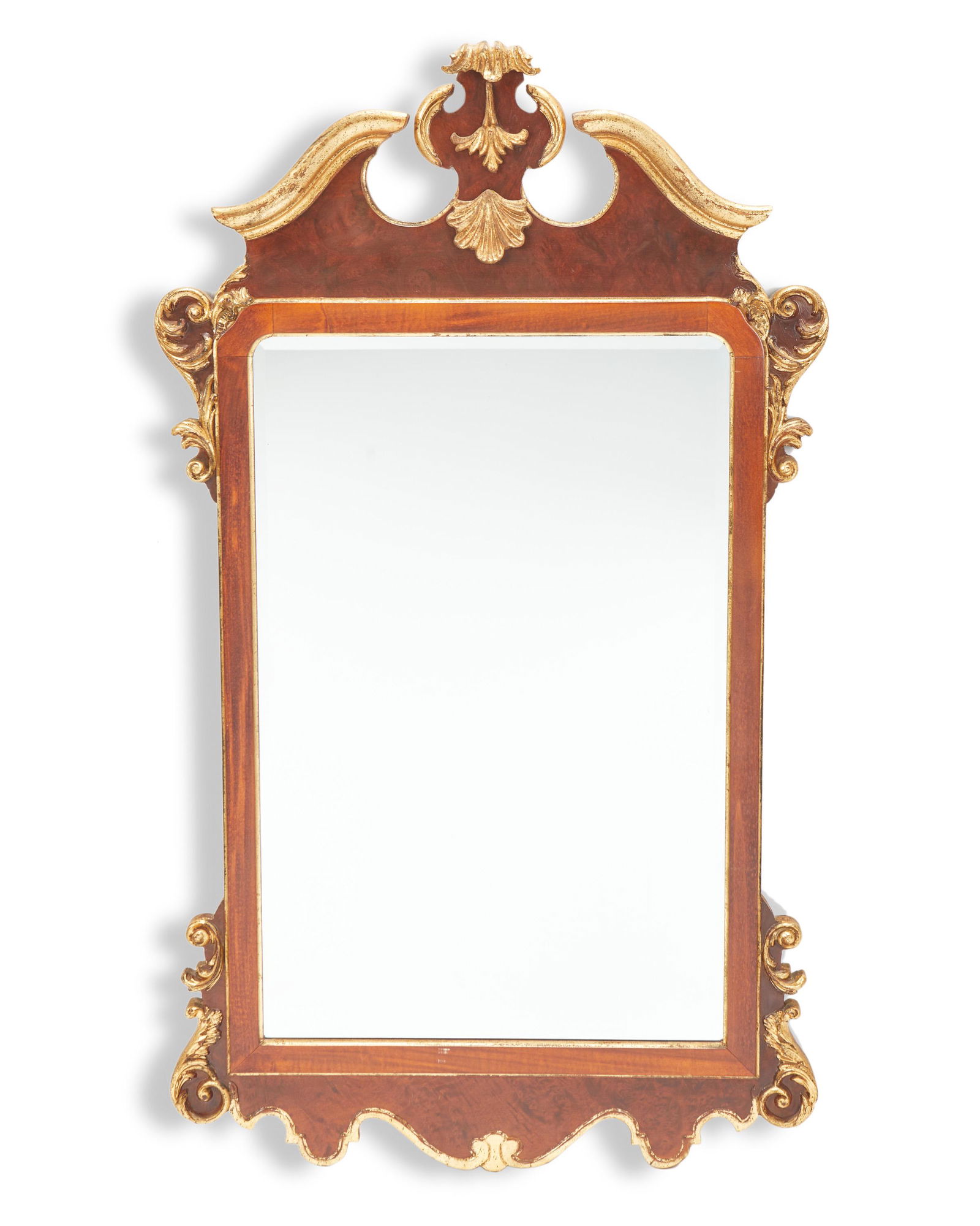 A La Barge Louis XVI-style carved giltwood wall mirror: Second-half 20th Century Frame marked: Made in Italy; With La Barge label With a broken pediment centering rocaille ornament atop a rectangular frame adorned with scrolled acanthus leaves enclosing