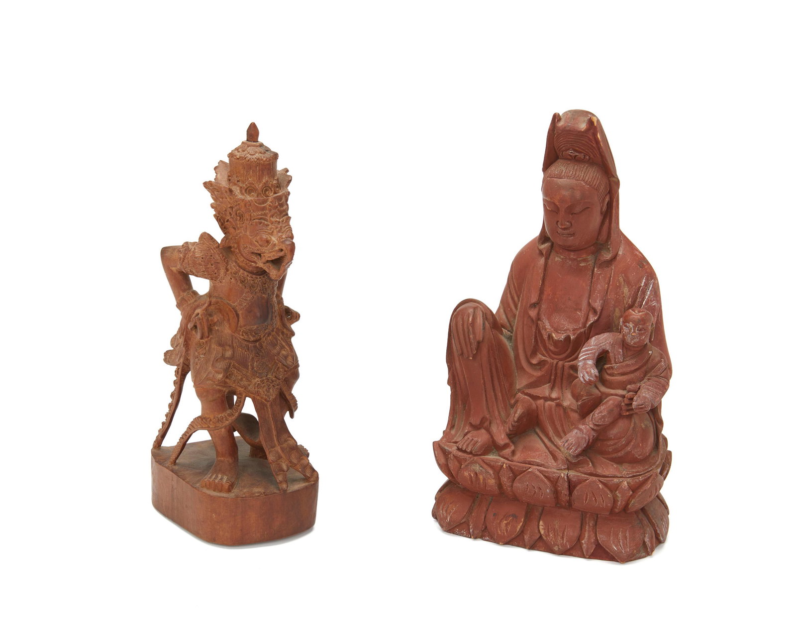 Two Asian carved wood figures: 20th Century Comprising a Chinese Guan Yin with a secret compartment at the back and a Balinese guardian figure, 2 pieces Larger: 8.5" H x 4.75" W x 3.75" D; Smaller: 8" H x 3.125" W x 3.625" D