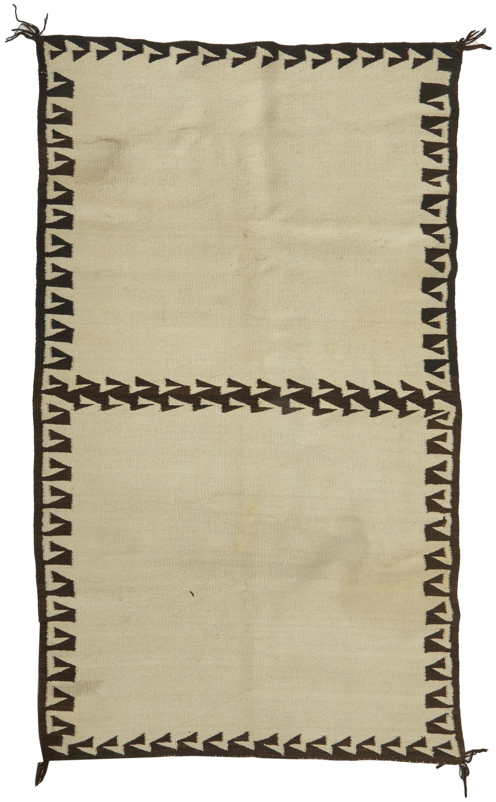 A Navajo/Dine double-sided saddle blanket: First-quarter 20th Century Woven in cream and dark brown with geometric border 51.5" L x 31" W Provenance: The Estate of Loren Ingraham, Montecito, CA