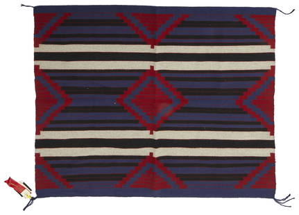 A Nina Yazzie Navajo/Dine Third Phase Revival: Fourth-quarter 20th Century With a Third Phase design woven in red, blue, black, and light grey 58" L x 58" W Provenance: Purchased from Hubbell Trading Post, Ganado, AZ, #30436 Exhibitions: Cas