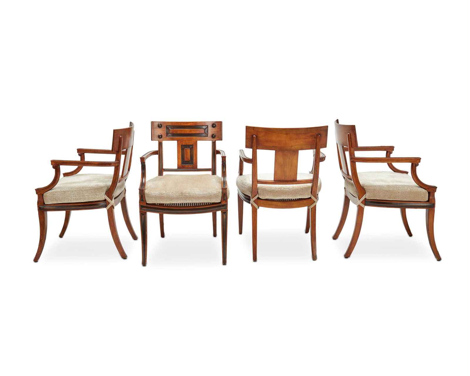 A set of Michael Taylor "White" armchairs: Late 20th/Early 21st Century; San Francisco, CA Each with metal factory tag Each carved mahogany armchair in walnut finish with ebonzied channel details, with straight top rail and backsplat flanked