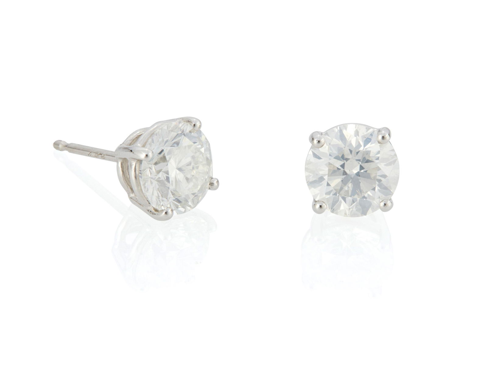 A pair of diamond stud earrings (1 of 2)