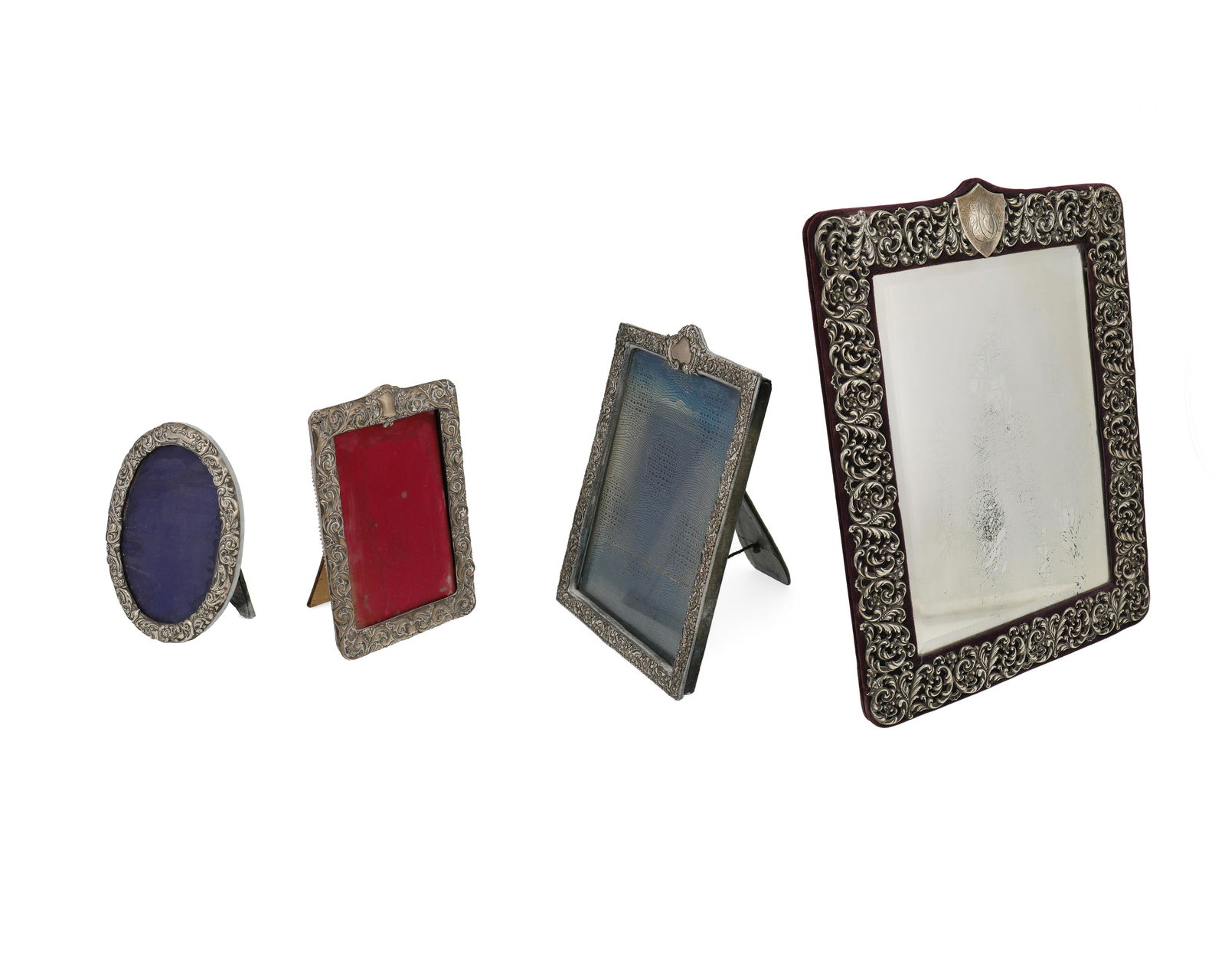 A group of silver table-top picture frames and mirror (1 of 2)