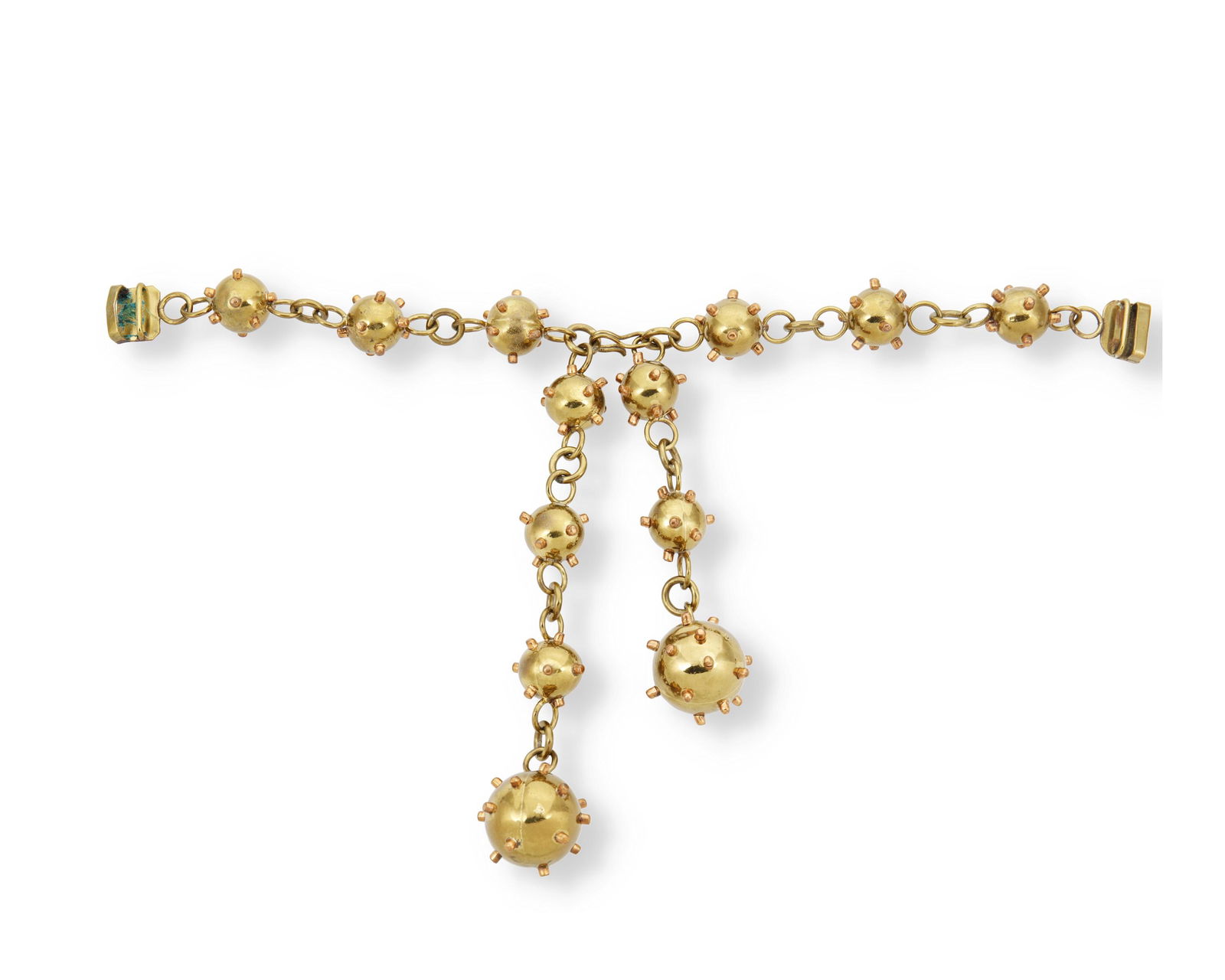 A Hubert Harmon mixed-metal bomb-motif belt: Circa 1940; Taxco, Mexico Stamped: Hubert Harmon Mexico The brass link belt suspending two brass and copper "bomb" pendant ends, with hook closure 16" L x 3.75" H 157.3 grams Provenance: The Col