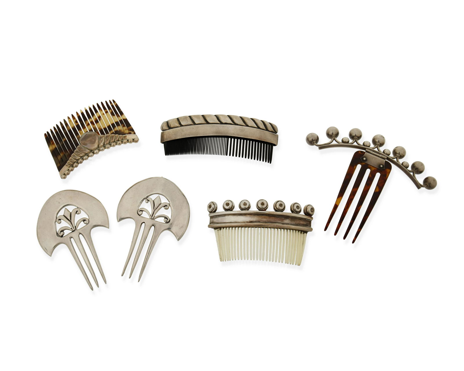 A group of silver hair combs (1 of 2)