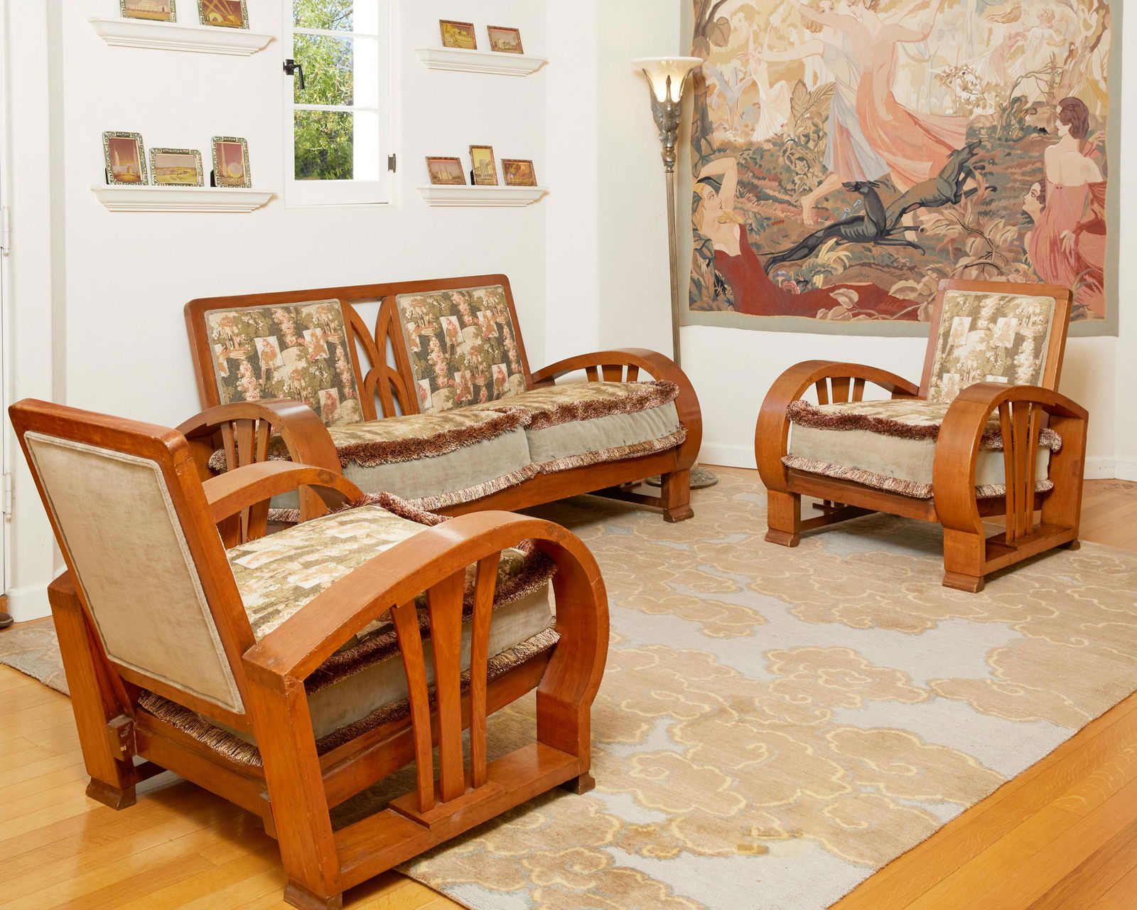 A set of Streamline Art Deco-style seating: 20th Century Each with a Streamline Moderne-style wood frame and contemporary avian motif upholstery, comprising two armchairs and a sofa, 3 pieces Sofa: 33.25" H x 64.5" W x 32" D; Each armchair: 3