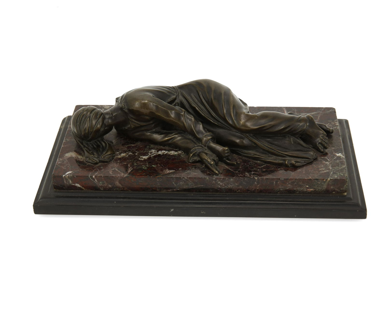 A Continental bronze sculpture of a recumbent figure (1 of 2)