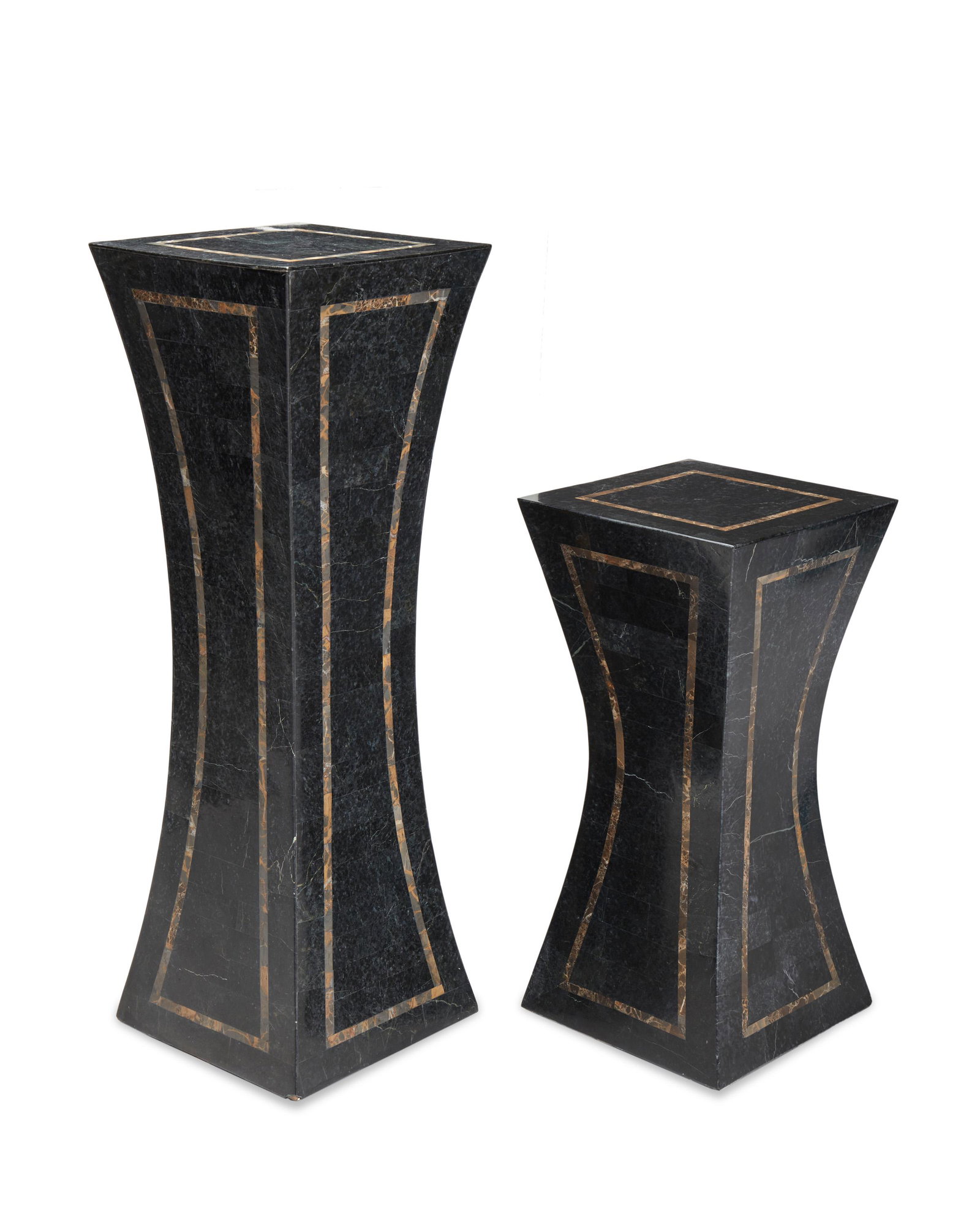 A near-pair of marble veneered pedestals: 20th Century Each concave pedestal with black marble veneer and brown marble banding, 2 pieces Larger: 42.375" H x 14.25" W x 14.25" D; Smaller: 29" H x 14" W x 14" D