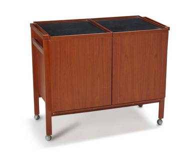 A Niels Erik Glasdam Jensen modern teak bar cart: Circa 1960s; Denmark With partially legible burn mark: Vantinge Mobelindustri / N.E. Glasdam Jensen / Made in Denmark The Danish mid-century modern expanding teak bar cart with sunken black