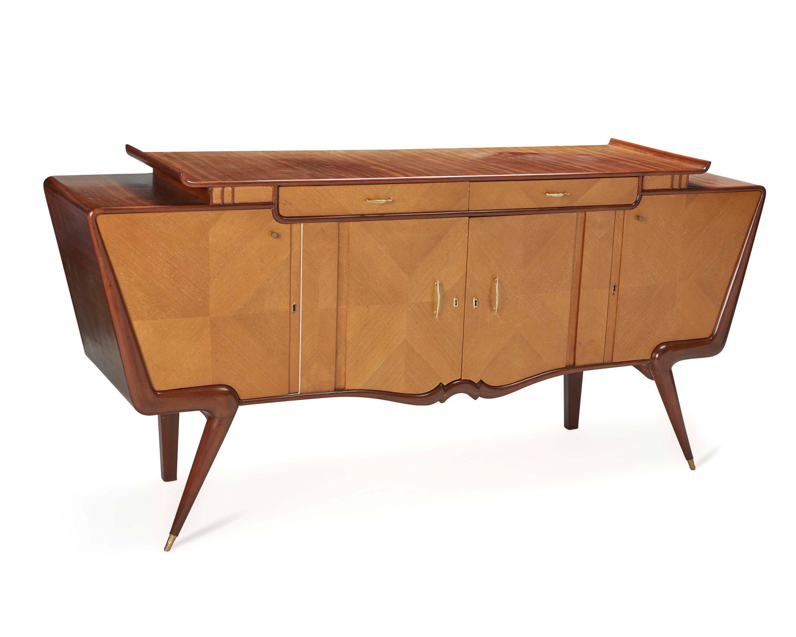 A Guiseppe Scapinelli-style modern credenza: Mid-20th Century The mid-century modern credenza with teak and book-matched veneers, brass hardware, a two-tiered top centering two long drawers over four lower cabinets, and raised on flared pole leg