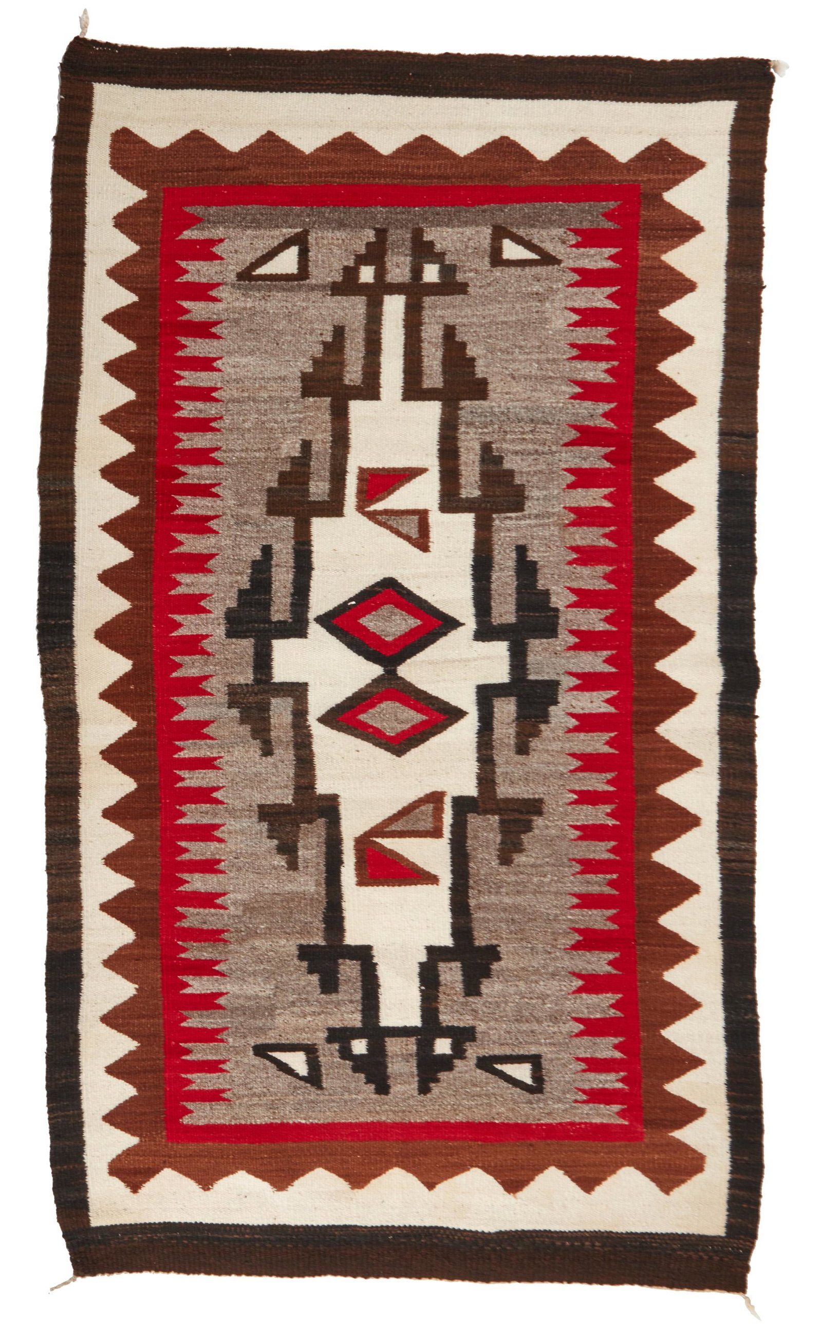 A Navajo Klagetoh rug: Second-Quarter 20th Century; Dine A Navajo rug woven in red, cream, light brown, dark brown, and grey wool with a central hooked diamond 71.5" H x 42.5" W