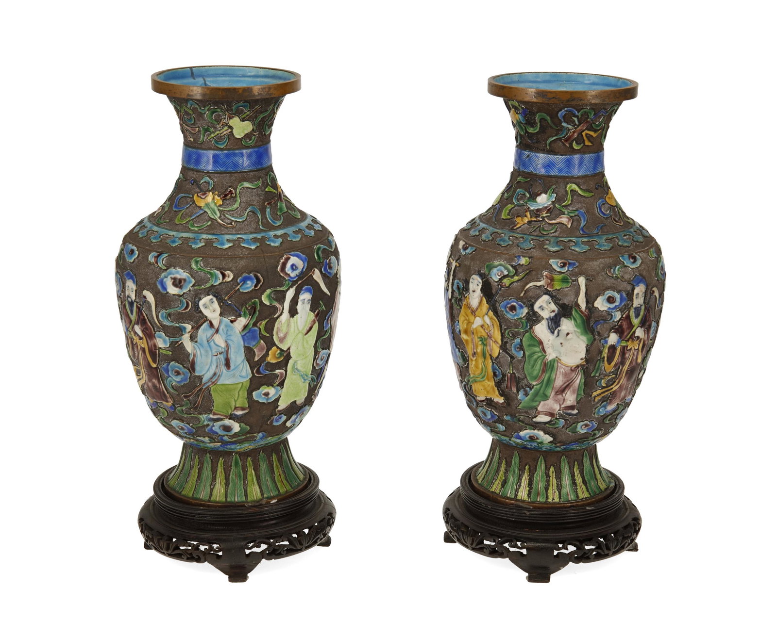 A pair of Chinese cloisonne vases: 20th century Each impressed to underside: China Each baluster-form vase with polychrome enamel figures against a texture metal ground, each on a carved wood stand, 2 pieces Each: 12" H x 5.25" Dia.