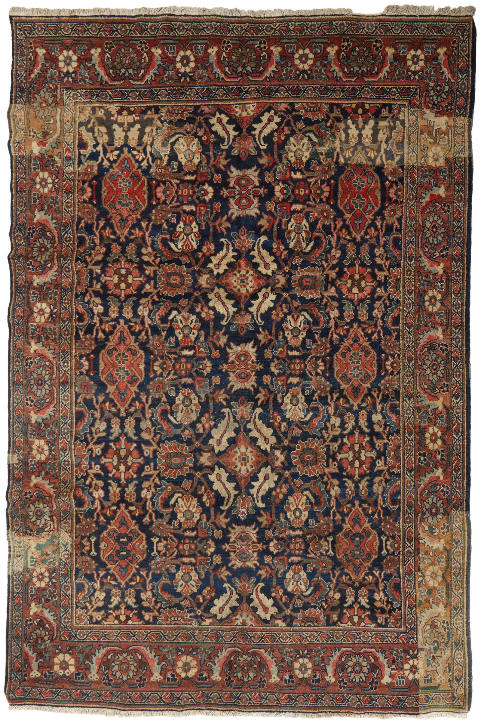 A Mahal area rug: 20th Century Wool on cotton foundation with polychrome geometric motifs 121.5" L x 85" W