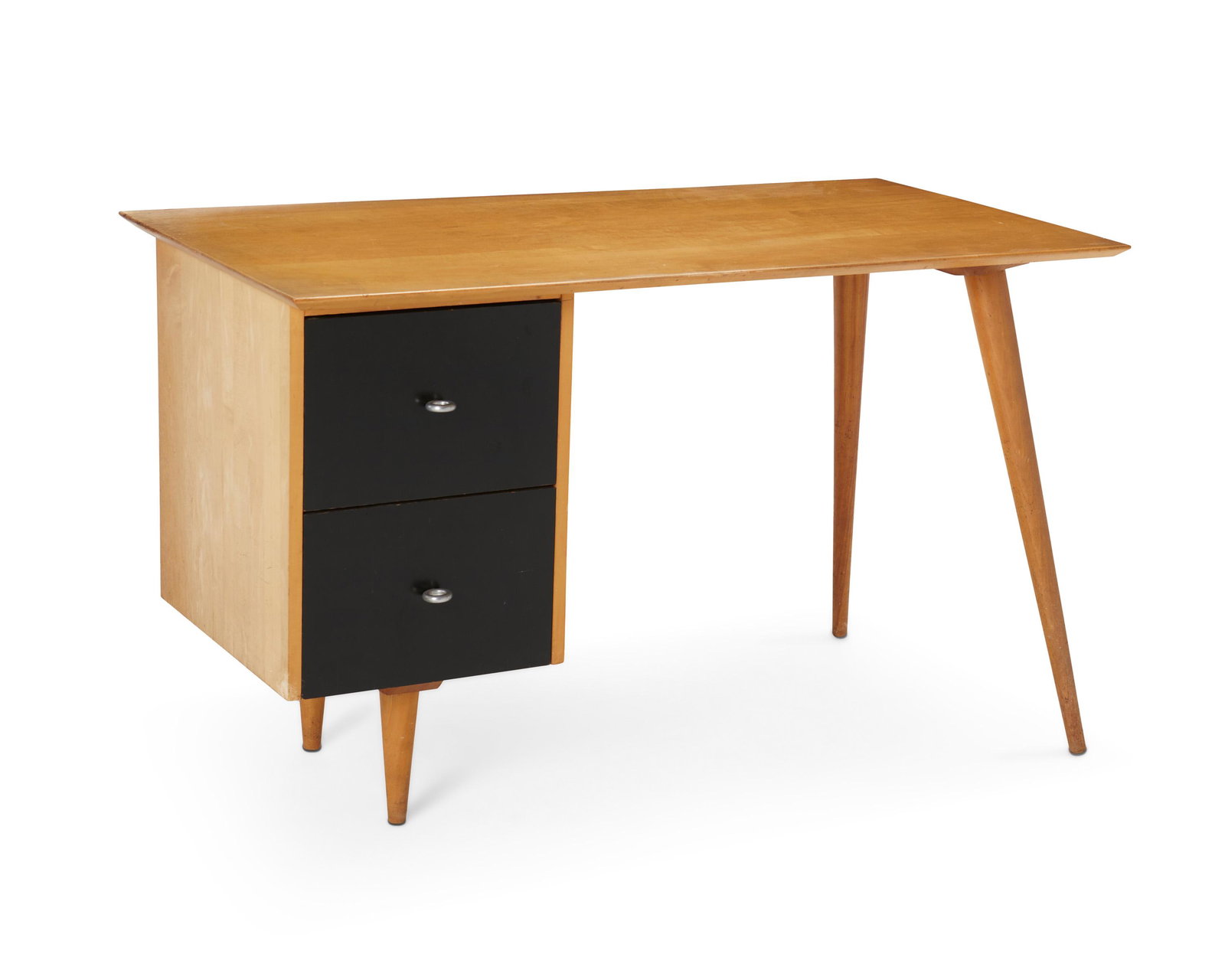 Paul Winthrop McCobb (1917-1969, American): Planner Group desk for Winchendon, no. 1560, circa 1955 Appears unmarked The maple desk with black finished drawers and steel loop handles raised on asymmetrical splayed conical legs 29.25" H x 48"