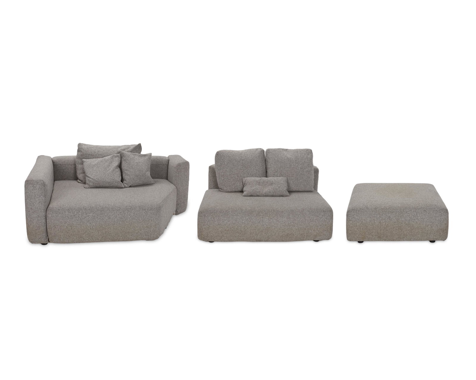 A Zanotta "Pianoalto" sectional sofa: 21st Century With Zanotta fabric label Design 2012 by Ludovica and Roberto Palomba, comprising two modular sectionals with three back cushions, three throw pillows, and an ottoman, raised on graphit