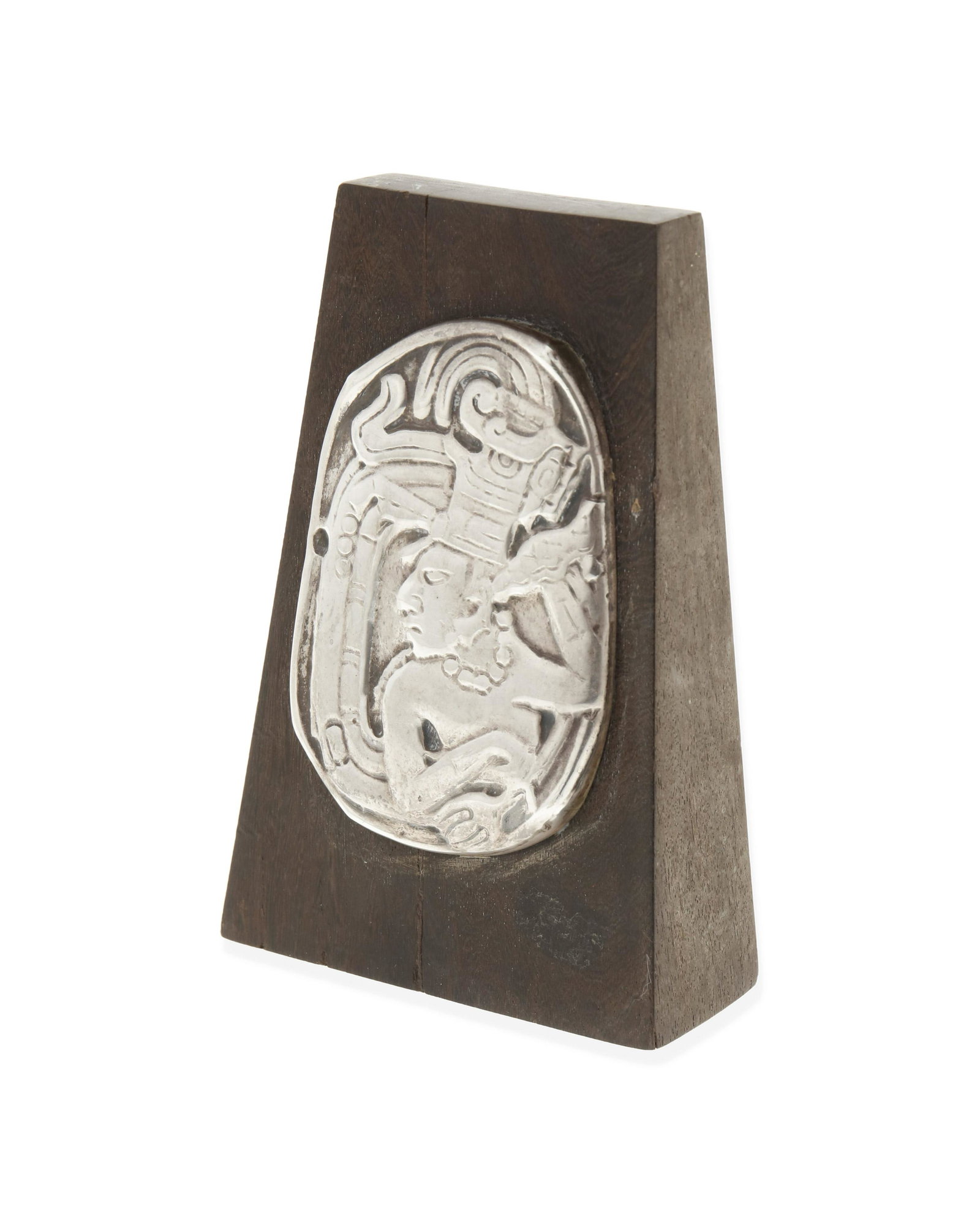 William Spratling (1900-1967, American): A silver and wood desk ornament, circa 1962-1964, Third Design Period; Taxco, Mexico Stamped to disc underneath for William Spratling; Further stamped: Taxco / Mexico / .925 A wedge-shaped wooden orna