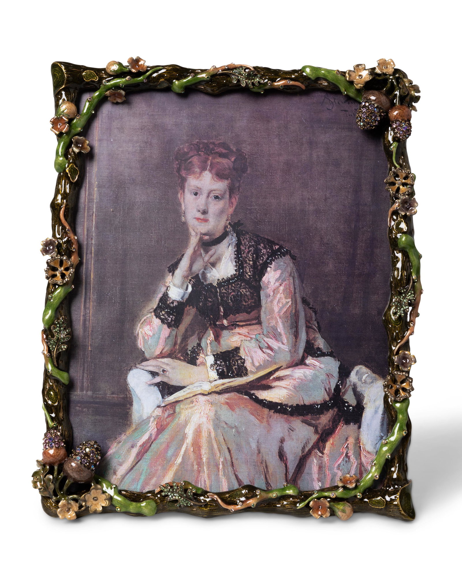 A Jay Strongwater jeweled enamel picture frame: 21st Century With Jay Strongwater mark With branch-style frame covered in flowers, oak leaves, and acorns 10.5" H x 9" W; opening: 9" H x 7" W Provenance: The Residential Property of Thomas and Erika 